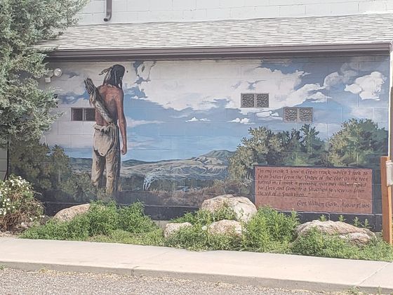 Mural 5 - depicts an Indian observing the Corps campires. 